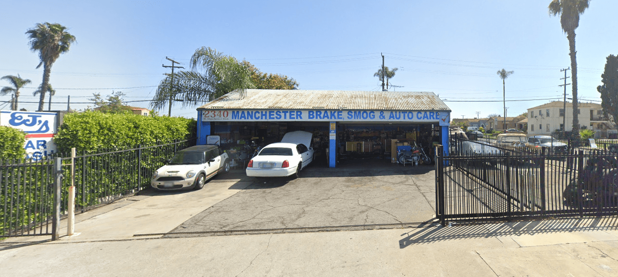 Manchester Brake, Smog & Auto Care storefront at 2340 W. Manchester Blvd in Inglewood — blue pillars, shop sign, open service bays